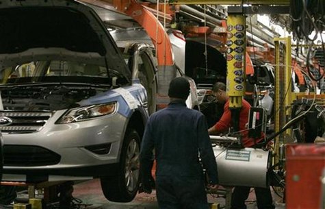 Workers place tires on the 2011 Ford Explorer and other vehicles at the Ford assembly plant in Chicago, Illinois, December 1, 2010. REUTERS/ Workers place tires on the 2011 Ford Explorer and other vehicles at the Ford assembly plant in Chicago, Illinois, December 1, 2010. REUTERS/