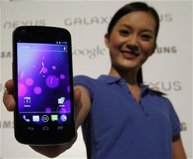 A model poses with the Galaxy Nexus, the first smartphone to feature Android 4.0 Ice Cream Sandwich and a HD Super AMOLED display, during a A model poses with the Galaxy Nexus, the first smartphone to feature Android 4.0 Ice Cream Sandwich and a HD Super AMOLED display, during a