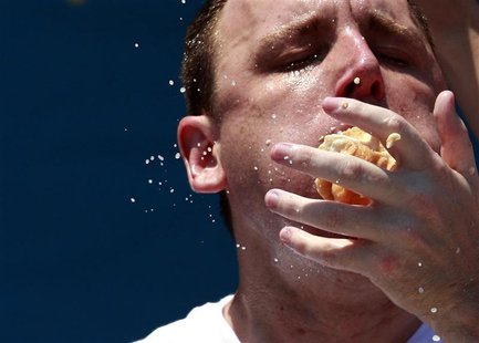 Joey Chestnut competes in the 2012 Nathan's Famous Fourth of July International Eating Contest at Coney Island in the Brooklyn borough of Ne Joey Chestnut competes in the 2012 Nathan's Famous Fourth of July International Eating Contest at Coney Island in the Brooklyn borough of Ne