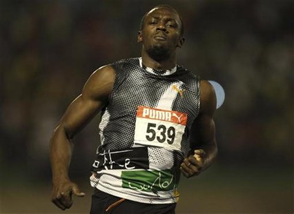 Usain Bolt runs during their men's 100 meters final event at the Jamaican Olympic trials in Kingston city, June 29, 2012. REUTERS/Ivan Alvar Usain Bolt runs during their men's 100 meters final event at the Jamaican Olympic trials in Kingston city, June 29, 2012. REUTERS/Ivan Alvar