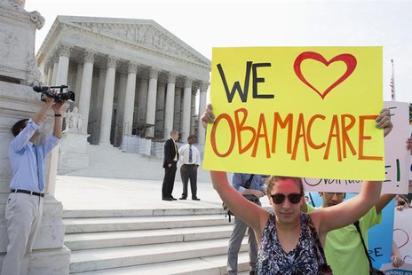 Supporters of the Affordable Healthcare Act gather in front of the Supreme Court before the court's announcement of the legality of the law Supporters of the Affordable Healthcare Act gather in front of the Supreme Court before the court's announcement of the legality of the law