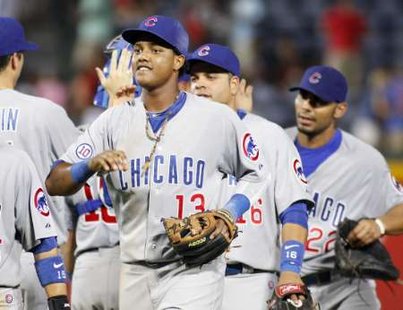 Starlin Castro celebrates with teammates at Turner Field in Atlanta, GA on August 13, 2011. Courtesy of Reuters. Starlin Castro celebrates with teammates at Turner Field in Atlanta, GA on August 13, 2011. Courtesy of Reuters.