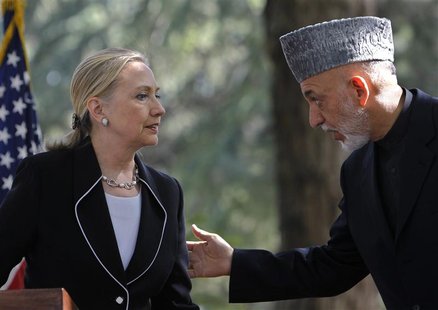 U.S. Secretary of State Hillary Clinton (L) and Afghan President Hamid Karzai hold a joint news conference in Kabul July 7, 2012. REUTERS/Om U.S. Secretary of State Hillary Clinton (L) and Afghan President Hamid Karzai hold a joint news conference in Kabul July 7, 2012. REUTERS/Om