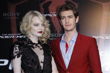 Actor Andrew Garfield (R) and U.S. actress Emma Stone arrive for the French premiere of "The Amazing Spider-Man" in Paris June 19, 2012. REU Actor Andrew Garfield (R) and U.S. actress Emma Stone arrive for the French premiere of "The Amazing Spider-Man" in Paris June 19, 2012. REU