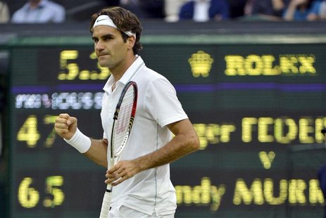 Roger Federer of Switzerland reacts to winning the third set in his men's singles final tennis match against Andy Murray of Britain at the W Roger Federer of Switzerland reacts to winning the third set in his men's singles final tennis match against Andy Murray of Britain at the W
