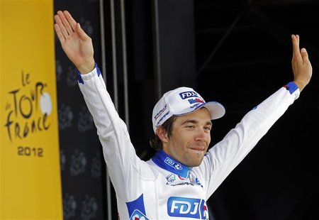 FDJ-Bigmat rider Thibaut Pinot of France celebrates on the podium after winning the eighth stage of the 99th Tour de France cycling race bet FDJ-Bigmat rider Thibaut Pinot of France celebrates on the podium after winning the eighth stage of the 99th Tour de France cycling race bet