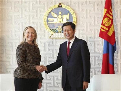 Secretary of State Hillary Clinton (L) shakes hands with Mongolia's Prime Minister Sukhbaatar Batbold during their meeting at the Parliament Secretary of State Hillary Clinton (L) shakes hands with Mongolia's Prime Minister Sukhbaatar Batbold during their meeting at the Parliament