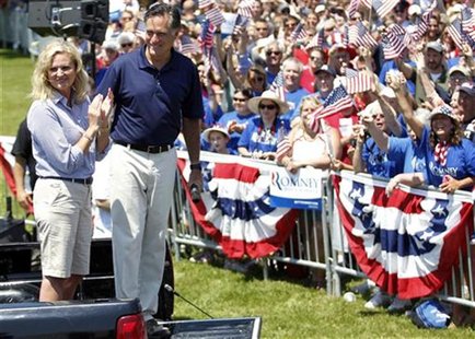 U.S. Republican presidential candidate and former Massachusetts Governor Mitt Romney smiles with his wife Ann (L) after addressing a crowd o U.S. Republican presidential candidate and former Massachusetts Governor Mitt Romney smiles with his wife Ann (L) after addressing a crowd o