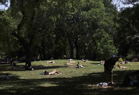 People sunbathe at Tompkins Square Park in New York July 8, 2012. REUTERS/Shannon Stapleton People sunbathe at Tompkins Square Park in New York July 8, 2012. REUTERS/Shannon Stapleton