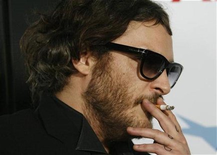Actor Joaquin Phoenix smokes a cigarette at the Los Angeles premiere of the movie "Che" during the AFI (American Film Institute) Fest 2008 a Actor Joaquin Phoenix smokes a cigarette at the Los Angeles premiere of the movie "Che" during the AFI (American Film Institute) Fest 2008 a