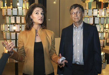Microsoft co-founder Bill Gates listens while his wife Melinda Gates speaks to the media at an advance tour of the newly constructed $15 mil Microsoft co-founder Bill Gates listens while his wife Melinda Gates speaks to the media at an advance tour of the newly constructed $15 mil