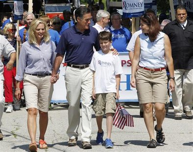 Ann Romney (L-R) holds the hand of her husband, U.S. Republican presidential candidate and former Massachusetts Governor Mitt Romney, as he Ann Romney (L-R) holds the hand of her husband, U.S. Republican presidential candidate and former Massachusetts Governor Mitt Romney, as he