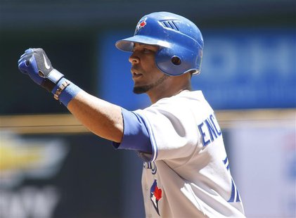Toronto Blue Jays' Edwin Encarnacion celebrates his home run against the Milwaukee Brewers during the second inning of their MLB baseball In Toronto Blue Jays' Edwin Encarnacion celebrates his home run against the Milwaukee Brewers during the second inning of their MLB baseball In