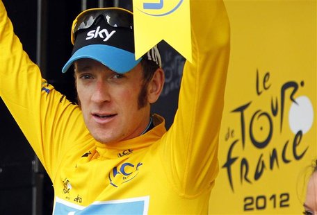 Sky Procycling rider Bradley Wiggins of Britain wears the leader's yellow jersey on the podium after the 12th stage of the 99th Tour de Fran Sky Procycling rider Bradley Wiggins of Britain wears the leader's yellow jersey on the podium after the 12th stage of the 99th Tour de Fran