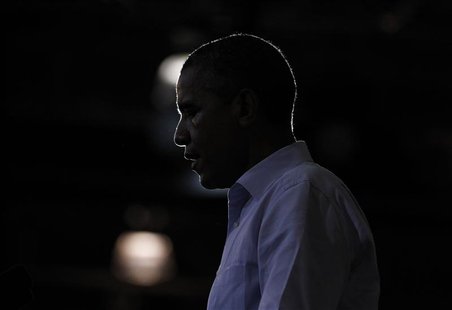 U.S. President Barack Obama is silhouetted during a campaign rally at Phoebus High School in Hampton, Virginia, July 13, 2012. REUTERS/Jason U.S. President Barack Obama is silhouetted during a campaign rally at Phoebus High School in Hampton, Virginia, July 13, 2012. REUTERS/Jason