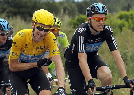 Sky Procycling rider and holding the leader's yellow jersey Bradley Wiggins of Britain (L) rides with his team mate Christian Knees of Germa Sky Procycling rider and holding the leader's yellow jersey Bradley Wiggins of Britain (L) rides with his team mate Christian Knees of Germa
