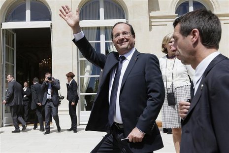 France's President Francois Hollande waves to visitors in the gardens of the Elysee Palace in Paris July 14, 2012. REUTERS/Kenzo Tribouillar France's President Francois Hollande waves to visitors in the gardens of the Elysee Palace in Paris July 14, 2012. REUTERS/Kenzo Tribouillar