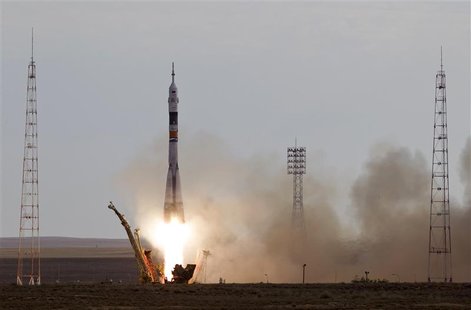 The Soyuz TMA-05M spacecraft carrying the International Space Station (ISS) crew of Russian cosmonaut Yuri Malenchenko, Japanese astronaut A The Soyuz TMA-05M spacecraft carrying the International Space Station (ISS) crew of Russian cosmonaut Yuri Malenchenko, Japanese astronaut A