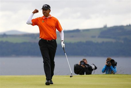 India's Jeev Milkha Singh reacts to making the winning putt during an extra play off hole against Italy's Francesco Molinari during the fina India's Jeev Milkha Singh reacts to making the winning putt during an extra play off hole against Italy's Francesco Molinari during the fina