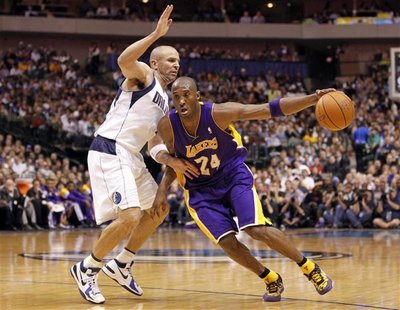 Los Angeles Lakers guard Kobe Bryant (R) drives past Dallas Mavericks guard Jason Kidd during the second half of their NBA basketball game i Los Angeles Lakers guard Kobe Bryant (R) drives past Dallas Mavericks guard Jason Kidd during the second half of their NBA basketball game i