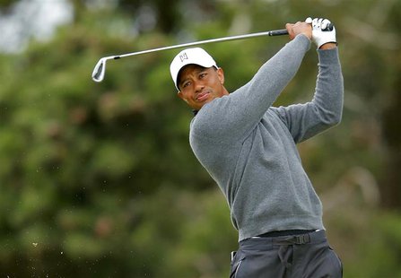 Tiger Woods of the U.S. watches his tee shot on the eighth hole during a practice round ahead of the British Open golf championship at Royal Tiger Woods of the U.S. watches his tee shot on the eighth hole during a practice round ahead of the British Open golf championship at Royal