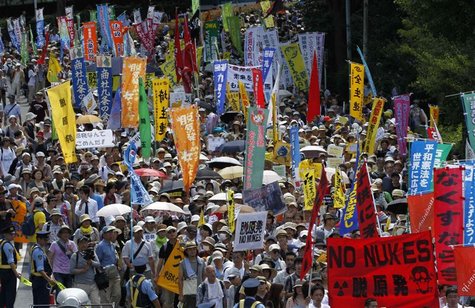 Protesters march during an anti-nuclear demonstration demanding a stop to the operation of nuclear power operations in Tokyo July 16, 2012. Protesters march during an anti-nuclear demonstration demanding a stop to the operation of nuclear power operations in Tokyo July 16, 2012.