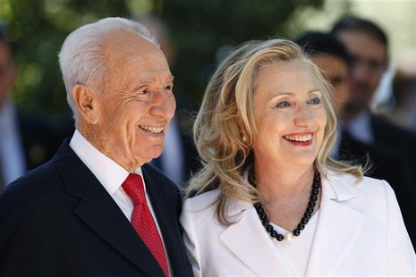 Israel's President Shimon Peres (L) stands with U.S. Secretary of State Hillary Clinton before their meeting in Jerusalem July 16, 2012. REU Israel's President Shimon Peres (L) stands with U.S. Secretary of State Hillary Clinton before their meeting in Jerusalem July 16, 2012. REU