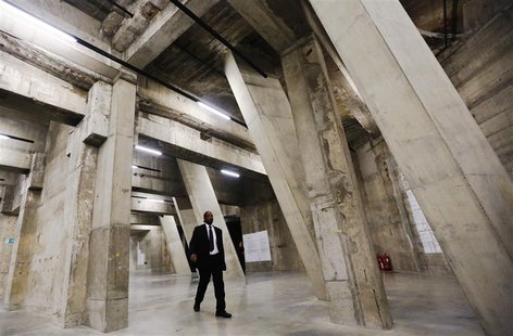 A worker walks through The Tanks, new galleries within the Tate Modern art gallery in London July 16, 2012. REUTERS/Luke MacGregor A worker walks through The Tanks, new galleries within the Tate Modern art gallery in London July 16, 2012. REUTERS/Luke MacGregor