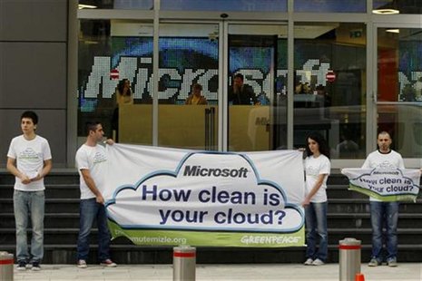 Greenpeace activists hold a banner during a demonstration against what they say are energy choices made by Microsoft, outside Microsoft's of Greenpeace activists hold a banner during a demonstration against what they say are energy choices made by Microsoft, outside Microsoft's of