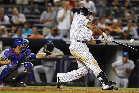 New York Yankees Raul Ibanez hits a grand slam in front of Toronto Blue Jays catcher J.P. Arencibia during the eighth inning of their MLB Am New York Yankees Raul Ibanez hits a grand slam in front of Toronto Blue Jays catcher J.P. Arencibia during the eighth inning of their MLB Am