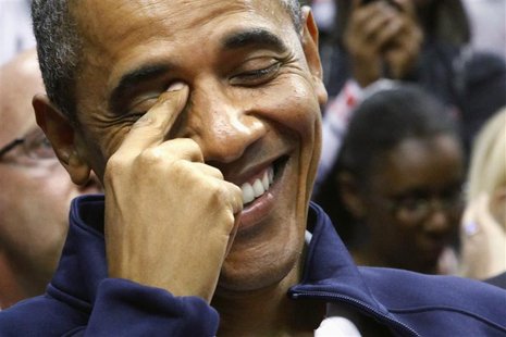 U.S. President Barack Obama smiles as he arrives to attend an Olympic basketball exhibition game between the U.S. and Brazil national men's U.S. President Barack Obama smiles as he arrives to attend an Olympic basketball exhibition game between the U.S. and Brazil national men's