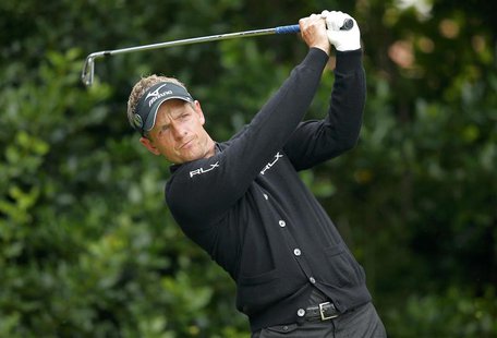 Luke Donald of England watches his tee shot on the first hole during a practice round ahead of the British Open golf championship at Royal L Luke Donald of England watches his tee shot on the first hole during a practice round ahead of the British Open golf championship at Royal L