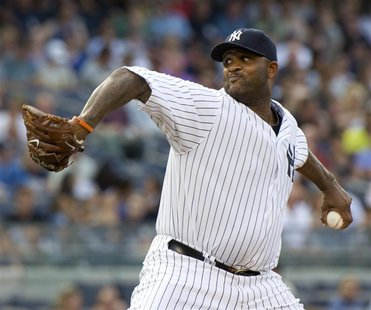 New York Yankees starting pitcher CC Sabathia throws a pitch to the Toronto Blue Jays in the first inning of their MLB American League baseb New York Yankees starting pitcher CC Sabathia throws a pitch to the Toronto Blue Jays in the first inning of their MLB American League baseb
