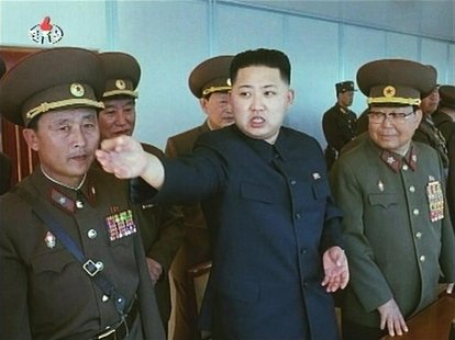 North Korea leader Kim Jong-un (C) speaks while surrounded by soldiers in this undated still image taken from video at an unknown location i North Korea leader Kim Jong-un (C) speaks while surrounded by soldiers in this undated still image taken from video at an unknown location i
