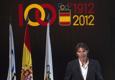 Tennis player Rafael Nadal, the official Spanish flag barrier at the London Olympics, speaks during a handover ceremony in Madrid in this fi Tennis player Rafael Nadal, the official Spanish flag barrier at the London Olympics, speaks during a handover ceremony in Madrid in this fi