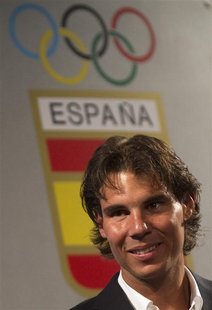 Tennis player Rafael Nadal, the official Spanish flag barrier at the London Olympics, smiles during a handover ceremony in Madrid in this fi Tennis player Rafael Nadal, the official Spanish flag barrier at the London Olympics, smiles during a handover ceremony in Madrid in this fi