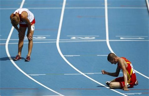Angel Mullera of Spain (R) sits on the track near Matthew Hughes of Canada after their men's 3,000 metres steeplechase heat at the IAAF Worl Angel Mullera of Spain (R) sits on the track near Matthew Hughes of Canada after their men's 3,000 metres steeplechase heat at the IAAF Worl