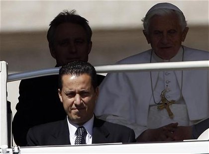 The Pope's butler, Paolo Gabriele (bottom L) arrives with Pope Benedict XVI (R) at St. Peter's Square in Vatican, in this file photo taken M The Pope's butler, Paolo Gabriele (bottom L) arrives with Pope Benedict XVI (R) at St. Peter's Square in Vatican, in this file photo taken M