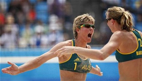 Natalie Cook (L) of Australia celebrates with her teammate Tamsin Barnett after they beat Russia in their preliminary beach volleyball match Natalie Cook (L) of Australia celebrates with her teammate Tamsin Barnett after they beat Russia in their preliminary beach volleyball match