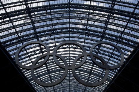 Olympic rings hang from the glass roof of St Pancras International Station in London, July 22, 2012. REUTERS/Neil Hall Olympic rings hang from the glass roof of St Pancras International Station in London, July 22, 2012. REUTERS/Neil Hall