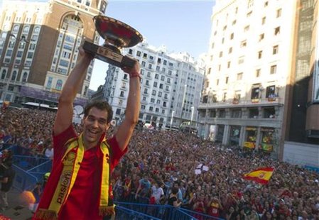 Spain's national basketball team player Jose Manuel Calderon raises the FIBA EuroBasket 2011 trophy during a celebration ceremony in central Spain's national basketball team player Jose Manuel Calderon raises the FIBA EuroBasket 2011 trophy during a celebration ceremony in central