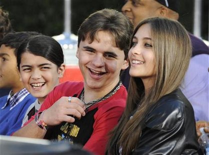 Michael Jackson's children (L-R) Blanket, Prince and Paris share a laugh at a ceremony where the singer is immortalized with hand and foot i Michael Jackson's children (L-R) Blanket, Prince and Paris share a laugh at a ceremony where the singer is immortalized with hand and foot i