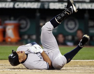 New York Yankees' Alex Rodriguez falls to the ground after being hit by a pitch from Seattle Mariners starting pitcher Felix Hernandez durin New York Yankees' Alex Rodriguez falls to the ground after being hit by a pitch from Seattle Mariners starting pitcher Felix Hernandez durin