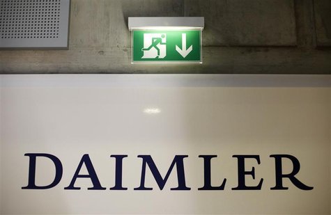 A emergency exit sign is pictured above a logo of German car manufacturer Daimler AG, before the annual news conference in Stuttgart Februar A emergency exit sign is pictured above a logo of German car manufacturer Daimler AG, before the annual news conference in Stuttgart Februar