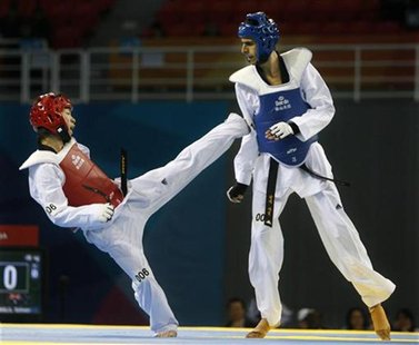 Japan's Kengo Uchimura (L) fights Australia's Safwan Khalil in the men's 58kg of Good Luck Beijing 2008 International Taekwondo Invitational Japan's Kengo Uchimura (L) fights Australia's Safwan Khalil in the men's 58kg of Good Luck Beijing 2008 International Taekwondo Invitational