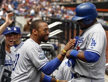 Los Angeles Dodgers Matt Kemp congratulates Juan Uribe after scoring on an RBI single by Dodgers Luis Cruz against the New York Mets during Los Angeles Dodgers Matt Kemp congratulates Juan Uribe after scoring on an RBI single by Dodgers Luis Cruz against the New York Mets during