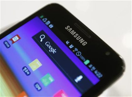 Samsung's logo is seen on a Galaxy smartphone displayed at the company's headquarters in Seoul July 6, 2012. REUTERS/Lee Jae-Won Samsung's logo is seen on a Galaxy smartphone displayed at the company's headquarters in Seoul July 6, 2012. REUTERS/Lee Jae-Won