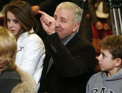 Aston Villa's owner Randy Lerner (C) gestures to photographers during a news conference at Villa Park in Birmingham, central England, Januar Aston Villa's owner Randy Lerner (C) gestures to photographers during a news conference at Villa Park in Birmingham, central England, Januar
