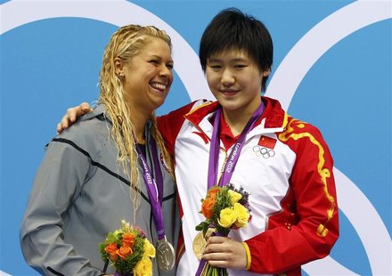 China's Ye Shiwen (R), with her gold medal, smiles with silver medal winner Elizabeth Beisel of the U.S. during the women's 400m individual China's Ye Shiwen (R), with her gold medal, smiles with silver medal winner Elizabeth Beisel of the U.S. during the women's 400m individual