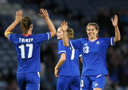 France's Camille Catala (R) celebrates with Gaetane Thiney and Corine Franco (C) after scoring the fifth goal against North Korea during the France's Camille Catala (R) celebrates with Gaetane Thiney and Corine Franco (C) after scoring the fifth goal against North Korea during the